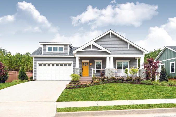 White short panel garage door with clear windows on a contemporary home
