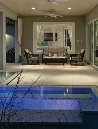 Window World 8500 Aluminum series white windows under a porch with a small pool area.