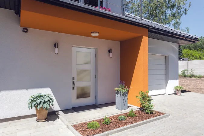 White smooth entry door with 3 large square lites on a modern home