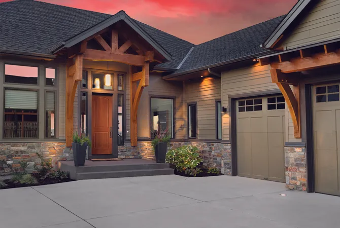 Woodgrain entry door on a rustic home with an attached garage