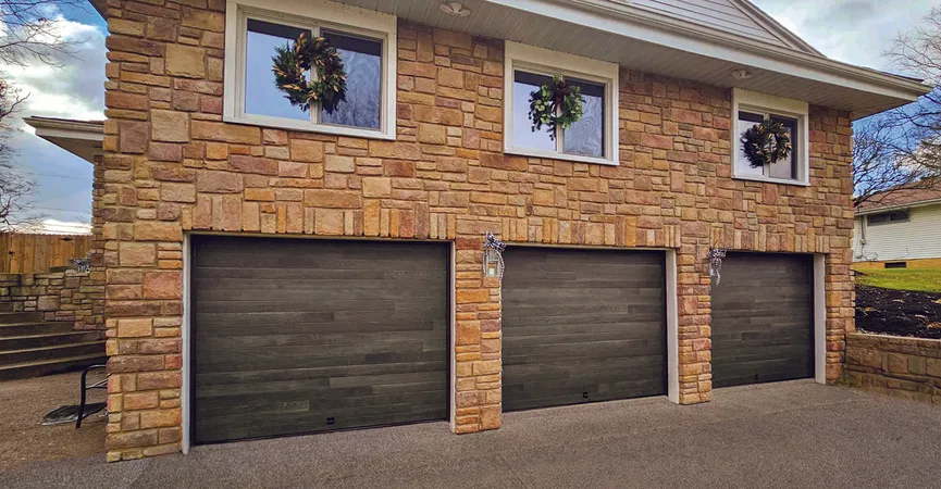 Carbon Oak contemporary residential garage door installed in a suburban family home