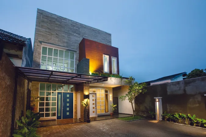 Modern townhome with 2 entry doors with 5 square lites, one door is blue, the other white